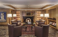 A fireplace and chair at the Beechwood Hotel