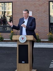 Man in suit at podium