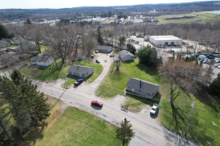 An aerial view of a five duplex housing complex