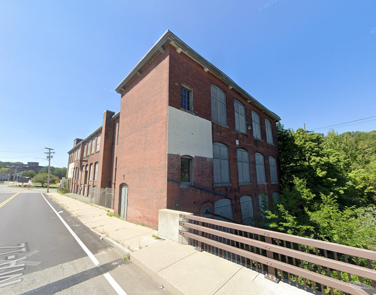 A three-story brick warehouse