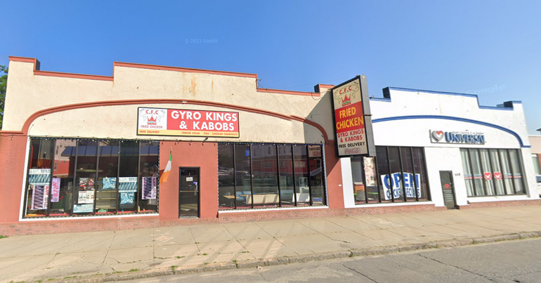 A chicken shop and a church in small retail storefronts