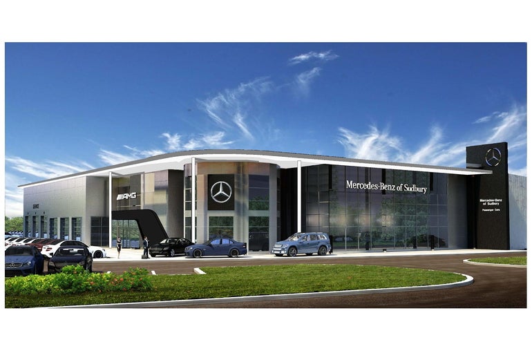 A rendering of a large car dealership with a glass wall, a Mercedes-Benz logo, and cars parked in the parking lot in front.