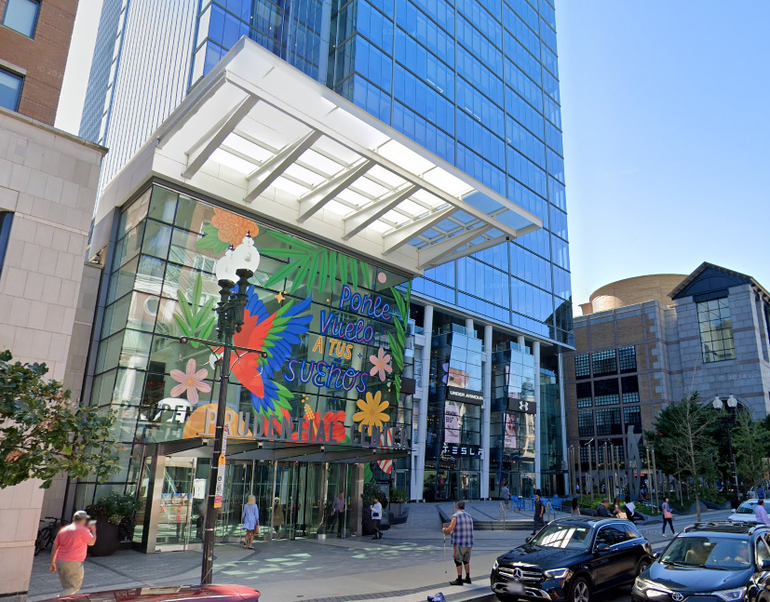 The entrance of a large commercial building in an urban area