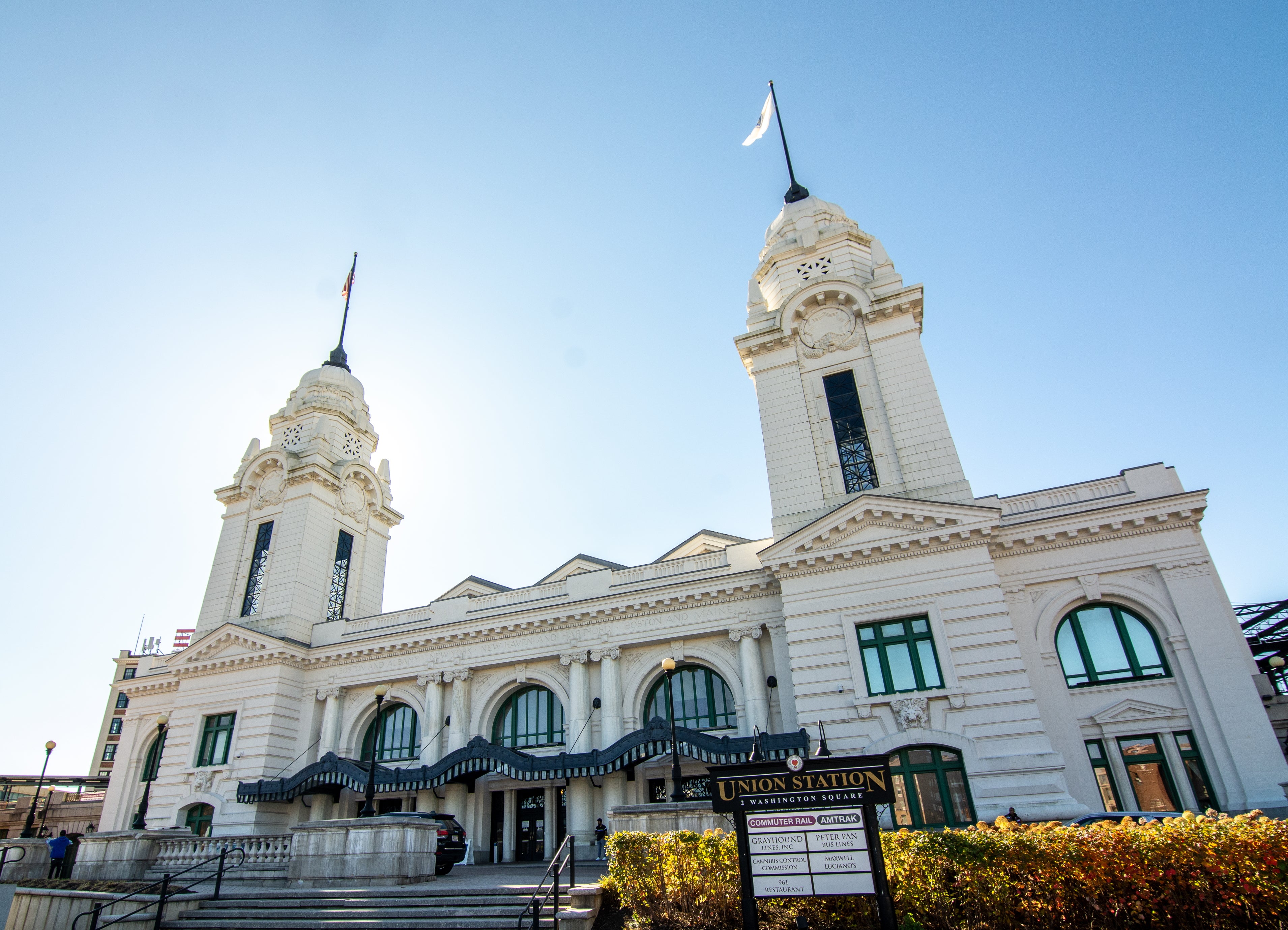 A large white train station with two spires