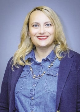 A woman with blonde hair smiling